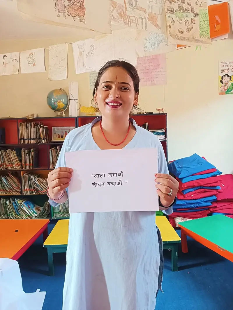 A participant holding a suicide-prevention message